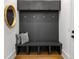 Stylish mudroom with built-in bench, storage, and wood flooring at 2641 Drew Valley Ne Rd, Brookhaven, GA 30319