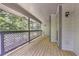 Cozy outdoor deck offers a serene view with lattice railing and wooded surroundings at 1244 Weatherstone Ne Dr, Atlanta, GA 30324