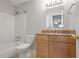 Bathroom with granite countertop vanity, tile floor, and shower-tub combo at 1244 Weatherstone Ne Dr, Atlanta, GA 30324