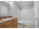 Bathroom features a vanity with granite countertops and a shower-tub combo at 1244 Weatherstone Ne Dr, Atlanta, GA 30324