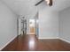 Bedroom featuring hardwood floors, ceiling fan, and hallway to other rooms at 1244 Weatherstone Ne Dr, Atlanta, GA 30324