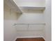 Walk-in closet with shelving and metal rods at 1244 Weatherstone Ne Dr, Atlanta, GA 30324