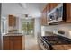 Kitchen features granite countertops, stainless steel appliances, and eat-in area at 1244 Weatherstone Ne Dr, Atlanta, GA 30324