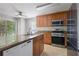 Kitchen with stainless steel appliances, granite countertops, and a breakfast bar at 1244 Weatherstone Ne Dr, Atlanta, GA 30324