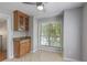 Kitchen nook features a ceiling fan, large window and a granite countertop buffet at 1244 Weatherstone Ne Dr, Atlanta, GA 30324