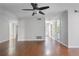 Spacious living room featuring hardwood floors, neutral paint, and access to other areas at 1244 Weatherstone Ne Dr, Atlanta, GA 30324