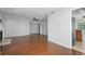 Open-concept living room features hardwood floors, ceiling fan, and neutral paint at 1244 Weatherstone Ne Dr, Atlanta, GA 30324