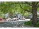 Outdoor parking area at Weatherstone Condominiums with mature trees and landscaped shrubs at 1244 Weatherstone Ne Dr, Atlanta, GA 30324