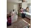 Spacious bedroom with neutral walls, carpet flooring and some toys and suitcases on the floor at 134 Sierra Cir, Woodstock, GA 30188