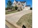 Well-maintained home with a two-car garage and long driveway offers ample parking and curb appeal at 134 Sierra Cir, Woodstock, GA 30188