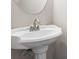 Elegant pedestal sink with brushed nickel faucet and round mirror for a classic bathroom look at 2861 Fareed, Douglasville, GA 30135