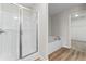 Bathroom with a glass-enclosed shower and a separate soaking tub at 2861 Fareed, Douglasville, GA 30135