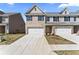 Charming two-story townhome with brick and siding, a driveway, and an attached single-car garage at 2861 Fareed, Douglasville, GA 30135