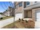 Attractive townhome exterior with a brick facade, single-car garage, and neatly landscaped front yard at 2861 Fareed, Douglasville, GA 30135