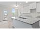 Kitchen featuring granite countertops and an island with a stainless steel sink at 2861 Fareed, Douglasville, GA 30135