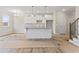 Stylish kitchen with white cabinets, a granite countertop island, and an open layout for entertaining at 2861 Fareed, Douglasville, GA 30135