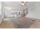 Spacious living area and kitchen featuring sleek white cabinets and stainless steel appliances at 2861 Fareed, Douglasville, GA 30135