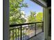 Balcony view of the parking lot, trees, and the exterior of an apartment building at 4246 River Green Nw Dr # 202, Atlanta, GA 30327