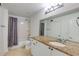 Bathroom featuring granite countertop, and shower with gray curtain at 4246 River Green Nw Dr # 202, Atlanta, GA 30327