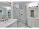 Elegant bathroom featuring a marble tiled shower, double vanity, and modern fixtures at 4246 River Green Nw Dr # 202, Atlanta, GA 30327