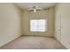 Spacious bedroom with carpet, ceiling fan and light, and window with blinds at 4246 River Green Nw Dr # 202, Atlanta, GA 30327