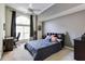 Cozy bedroom with arched window, ceiling fan and neutral decor at 4246 River Green Nw Dr # 202, Atlanta, GA 30327