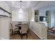 Bright dining area featuring a round table, chandelier, and open floor plan at 4246 River Green Nw Dr # 202, Atlanta, GA 30327
