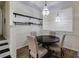 Cozy dining area with elegant chandelier, dark wood table, and stylish shelving at 4246 River Green Nw Dr # 202, Atlanta, GA 30327
