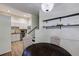 Dining room featuring wood floors, stylish shelving, and a view of the kitchen area at 4246 River Green Nw Dr # 202, Atlanta, GA 30327