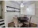 Cozy dining area featuring wood floors, modern lighting, and stylish decor on shelves at 4246 River Green Nw Dr # 202, Atlanta, GA 30327