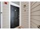 Stylish black front door with a modern doorbell and a horseshoe accent, provides a welcoming entrance at 4246 River Green Nw Dr # 202, Atlanta, GA 30327