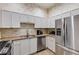 Well-equipped kitchen featuring stainless steel appliances, tile backsplash, and ample counter space at 4246 River Green Nw Dr # 202, Atlanta, GA 30327