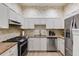 Modern kitchen featuring stainless steel appliances, tile backsplash and granite countertops at 4246 River Green Nw Dr # 202, Atlanta, GA 30327