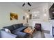 Open living room features a comfortable gray sofa, fireplace and stairs leading to other floors at 4246 River Green Nw Dr # 202, Atlanta, GA 30327