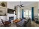 Inviting living room boasts a fireplace, built-in shelves, and bright windows with blue curtains at 4246 River Green Nw Dr # 202, Atlanta, GA 30327