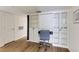 View of the office space with built-in features, wood floors, and neutral walls at 4246 River Green Nw Dr # 202, Atlanta, GA 30327