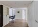A well-lit office space featuring hardwood floors, built-in shelving, and cabinets for storage at 4246 River Green Nw Dr # 202, Atlanta, GA 30327