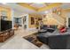 Bright finished basement with stairs, leather furniture, and open layout at 4855 Regency Sw Trce, Atlanta, GA 30331