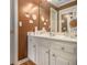 Traditional bathroom featuring a white vanity and decorative wall art at 4855 Regency Sw Trce, Atlanta, GA 30331