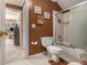 Cozy bathroom with a shower over tub, tile flooring and toilet at 4855 Regency Sw Trce, Atlanta, GA 30331