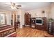 Comfortable bedroom with a four-poster bed, dresser, and a ceiling fan at 4855 Regency Sw Trce, Atlanta, GA 30331
