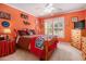 This bedroom features a ceiling fan, shutters, wood floors and bright colors at 4855 Regency Sw Trce, Atlanta, GA 30331