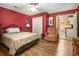 Comfortable bedroom showing the closet and a view of the adjoining kitchen at 4855 Regency Sw Trce, Atlanta, GA 30331