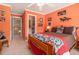 This bedroom features bright colors, ceiling fan and patterned bedding at 4855 Regency Sw Trce, Atlanta, GA 30331