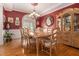 Elegant dining room with hardwood floors, chandelier, and large window for natural light at 4855 Regency Sw Trce, Atlanta, GA 30331
