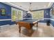 Game room with pool table, wainscoting, and bright natural light at 4855 Regency Sw Trce, Atlanta, GA 30331