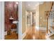 Inviting hallway featuring hardwood floors, neutral walls, and elegant trim work at 4855 Regency Sw Trce, Atlanta, GA 30331