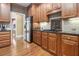 Well-lit kitchen featuring granite countertops, stainless steel appliances, and ample wooden cabinetry at 4855 Regency Sw Trce, Atlanta, GA 30331