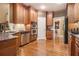 Well-equipped kitchen featuring stainless steel appliances, granite countertops, and wooden cabinets at 4855 Regency Sw Trce, Atlanta, GA 30331