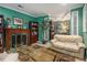 Inviting living room boasts a fireplace, built-in bookcases, and comfortable seating at 4855 Regency Sw Trce, Atlanta, GA 30331